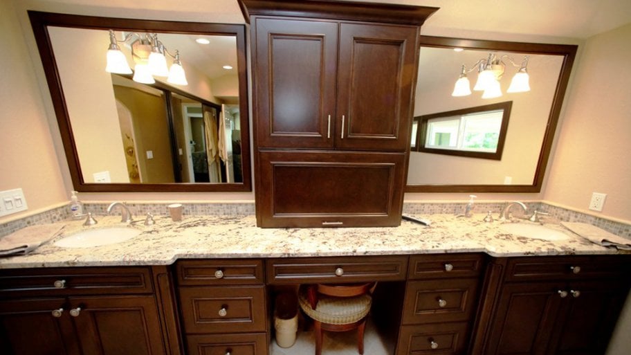 dark wood bathroom vanity storage space double sinks double mirrors